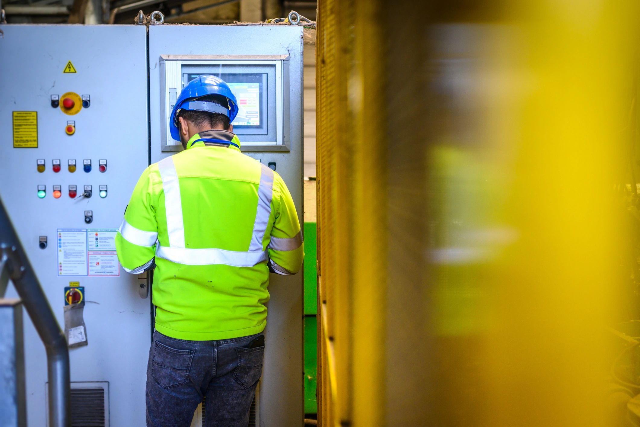 Engineer monitoring industrial control systems