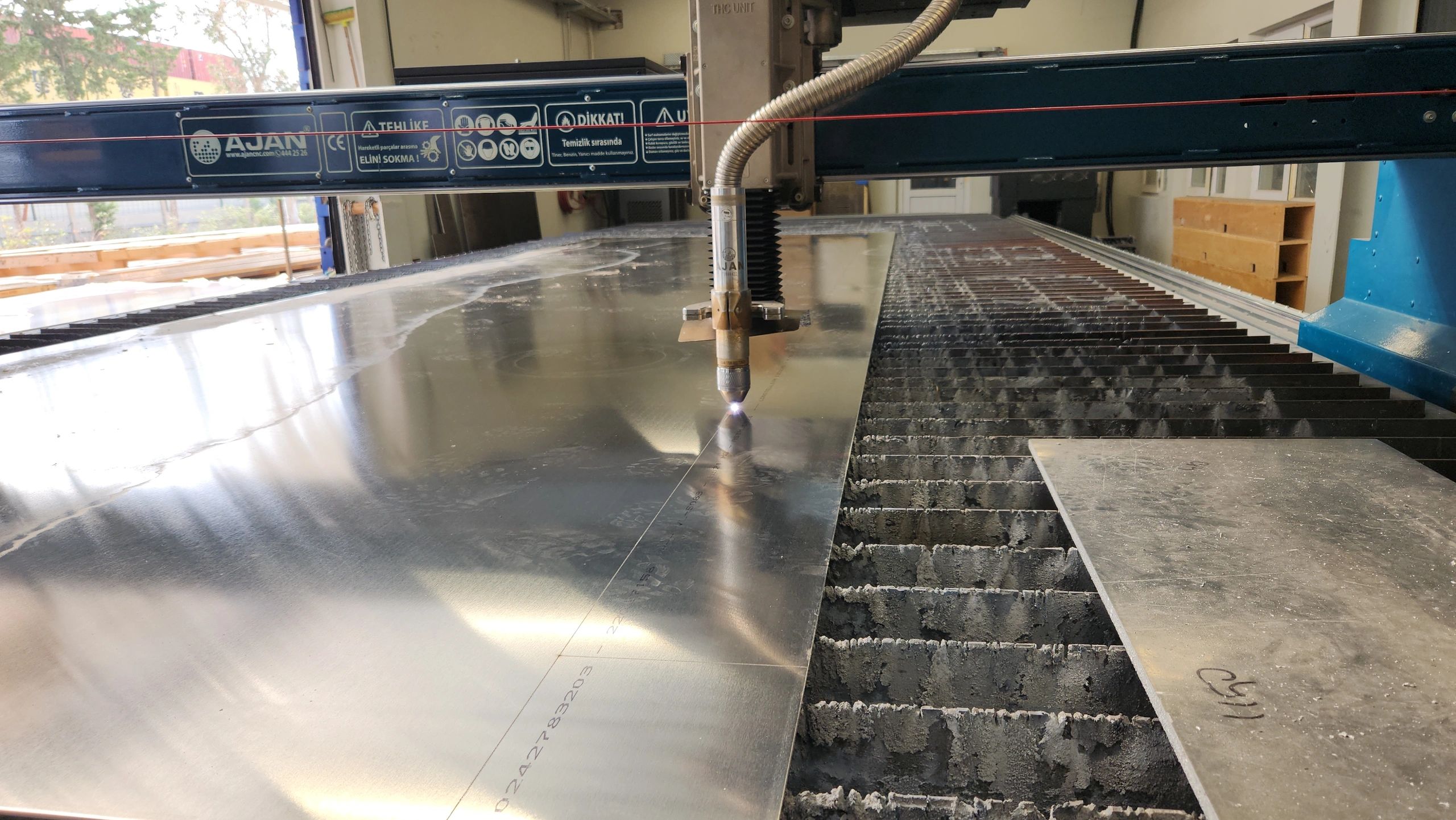 Industrial fabrication equipment in operation for custom manufacturing work