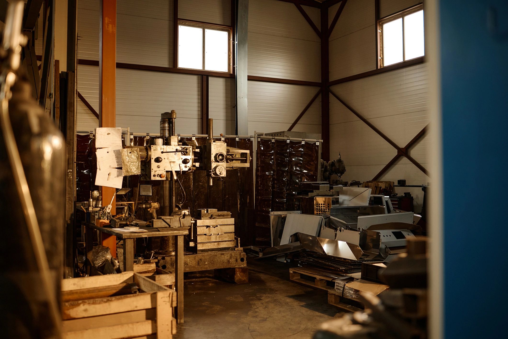 Industrial workshop with heavy machinery and fabrication equipment